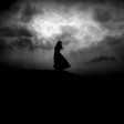 silhouette  of woman in the dark