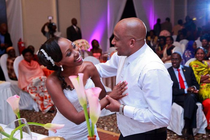 A groom dancing with his bride.