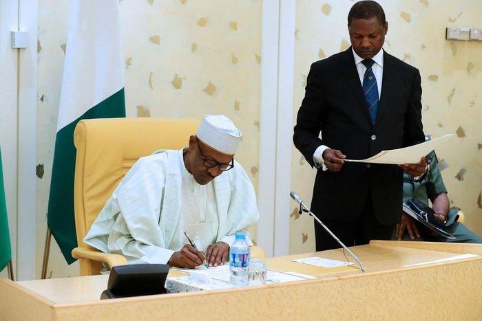 buhari signing the news nigeria