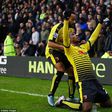 Odion Ighalo celebrates his goal against Tottenham with Watford teammate and Ikechi Anya
