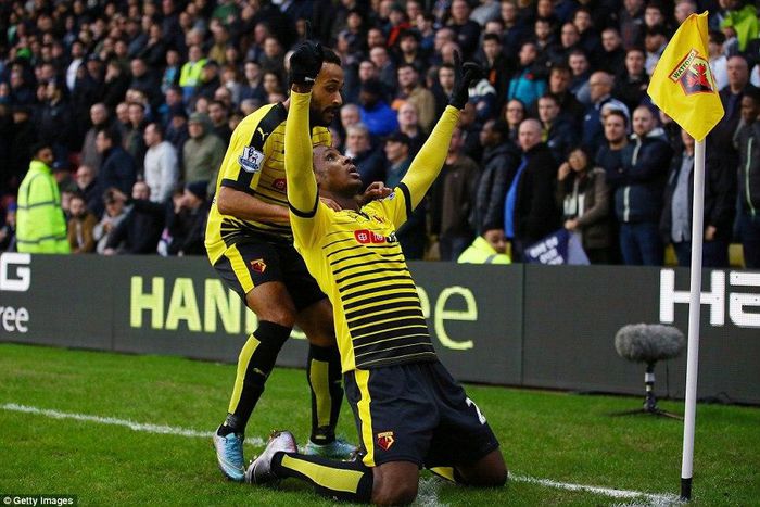 Odion Ighalo celebrates his goal against Tottenham with Watford teammate and Ikechi Anya