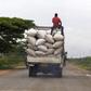 A man rides atop a truck ferrying bags of maize to a market along a road in the outskirts of Burundi's capital Bujumbura, April 30, 2015. REUTERS/Thomas Mukoya