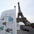 An information board about climate change is seen on a bridge near the Eiffel Tower ahead of the World Climate Conference 2015 (COP21), in Paris, France, November 28, 2015.