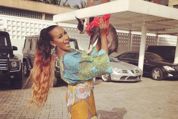 DJ Cuppy in front of her garage.