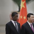 Zambia's President Edgar Lungu (L) and China's President Xi Jinping listen to their national anthems during a welcoming ceremony at the Great Hall of the People in Beijing, March 30, 2015. REUTERS/Jason Lee