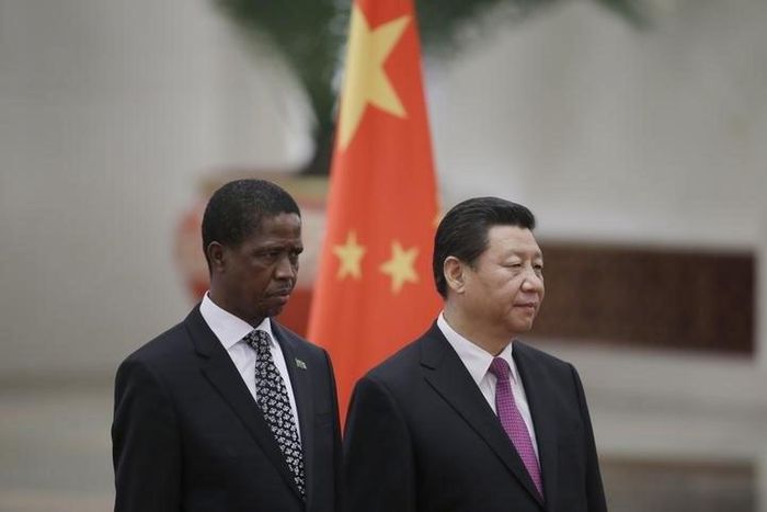 Zambia's President Edgar Lungu (L) and China's President Xi Jinping listen to their national anthems during a welcoming ceremony at the Great Hall of the People in Beijing, March 30, 2015. REUTERS/Jason Lee