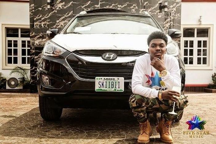 Skiibbi posing for a photo with brand new Hyundai 2014 SUV.