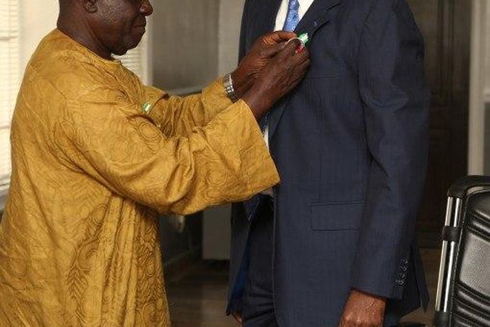 Minister of Power , Works and Housing , Mr Babatunde Fashola SAN (right) being decorated with the Armed Forces Remembrance Day Celebration Emblem 2016 by the National Chairman, Nigerian Legion, Colonel Micah Gaya (retd.) at the Honourable Minister’s Of...