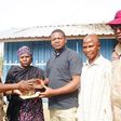 Acting unit head of operations, Yangoji unit command of the Federal Road Safety Corps (FRSC), Amadi Chika, left, handing the money over to the owners