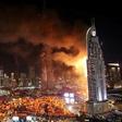 14 injured as skyscraper hotel catches fire during New Year celebrations