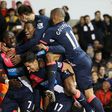Newcastle match winner Ayoze Perez (centre) is mobbed by team-mates having scored a late goal against Tottenham