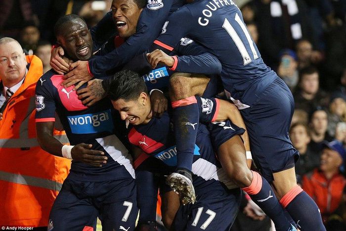 Newcastle match winner Ayoze Perez (centre) is mobbed by team-mates having scored a late goal against Tottenham