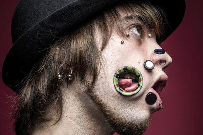 Man spent 2 million Naira tearing holes through his face [Graphic]