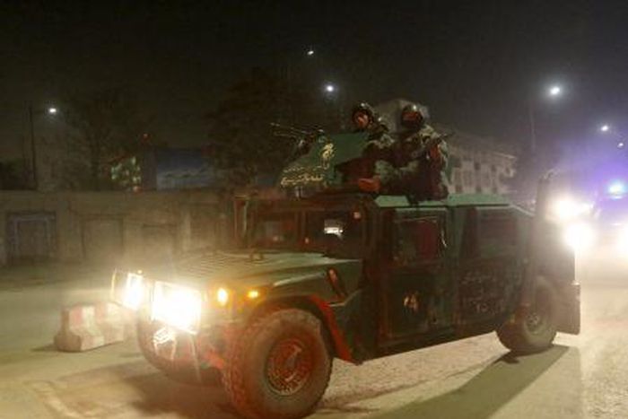 Afghan policemen arrive at the site of a Taliban attack in the Afghan capital of Kabul, Afghanistan December 11, 2015.
