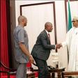 Kayode Akintemi of Channel television exchanges pleasantries at Presidential media chat.