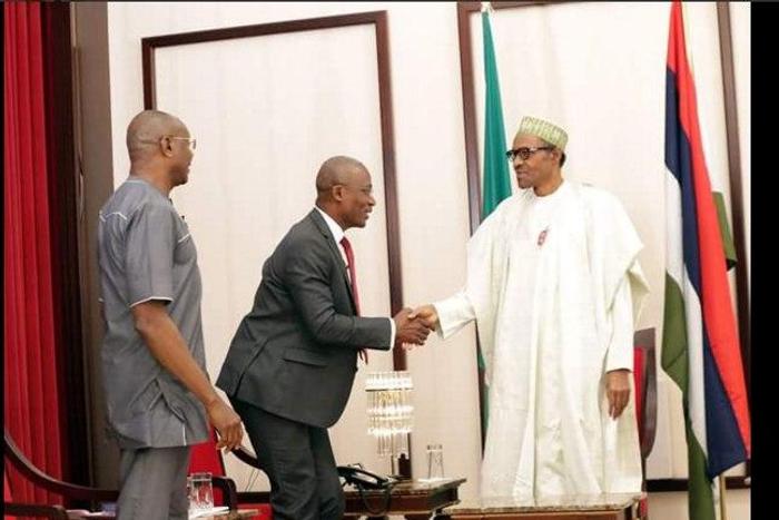 Kayode Akintemi of Channel television exchanges pleasantries at Presidential media chat.