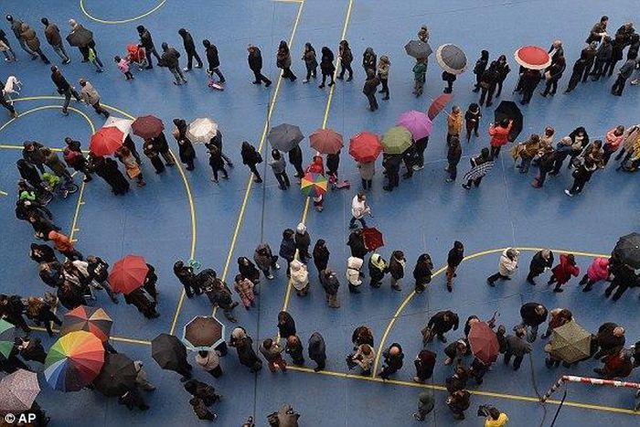 ___4079649___https:______static.pulse.com.gh___webservice___escenic___binary___4079649___2015___8___17___19___1415557435259_wps_27_People_queue_to_cast_thei