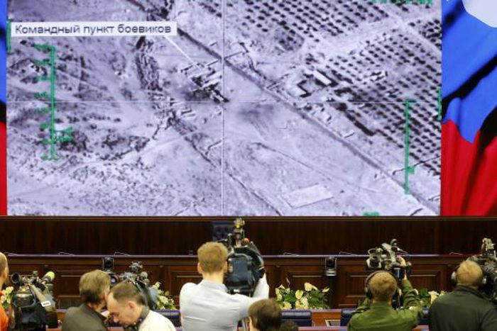 Journalists attend a briefing at the headquarters of Russia's defence ministry in Moscow, Russia, December 25, 2015.
