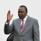 Kenya's President Uhuru Kenyatta salutes guests as he prepares to receive Pope Francis at the State House in Kenya's capital Nairobi, November 25, 2015. REUTERS/Thomas Mukoya