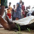 Residents look at the slain bodies of people killed at the Cibitoke district in Burundi"s capital Bujumbura, December 9, 2015.