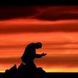 Silhouette of man on his knees