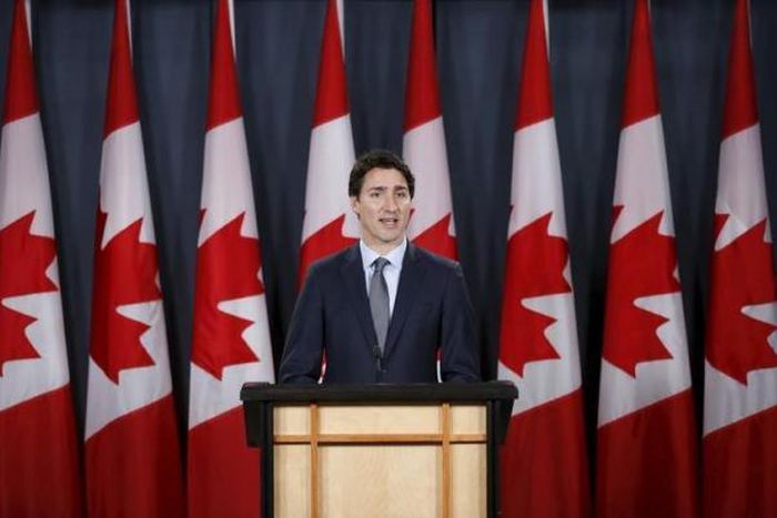 Canada PM brushes off critics, says to stick course on refugees