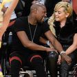 Floyd Mayweather and girlfriend Doralie Medina  watching a basket ball game