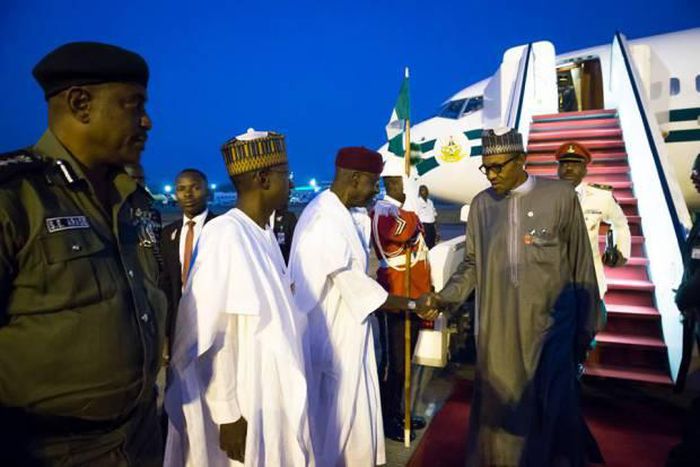 President Muhammadu Buhari returns to Nigeria from Paris on December 1, 2015