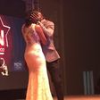 Seun Akindele and Roseanne Marcel sharing a kiss at the 2015 Best of Nolywood Awards