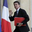 French PM warns of more attacks as police raid suspected Islamist homes