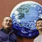 Zeng Fanzhi and Jack Ma strike a pose with their Earth painting which sold for $5.4 million at a Sotheby's auction