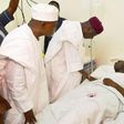 Chief of Staff to the President, Abba Kyari, SSA Media Garba Shehu with the injured NAF pilot in hospital