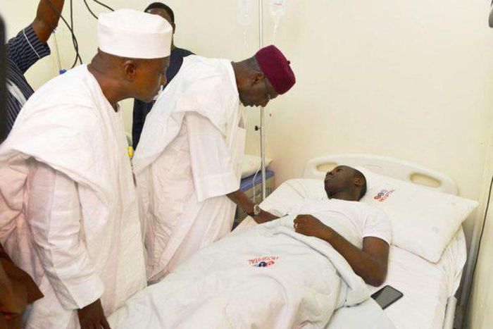 Chief of Staff to the President, Abba Kyari, SSA Media Garba Shehu with the injured NAF pilot in hospital