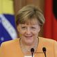 Germany's Merkel condemns "disgusting" violence against refugees