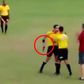 Soccer referee pulls out gun mid match