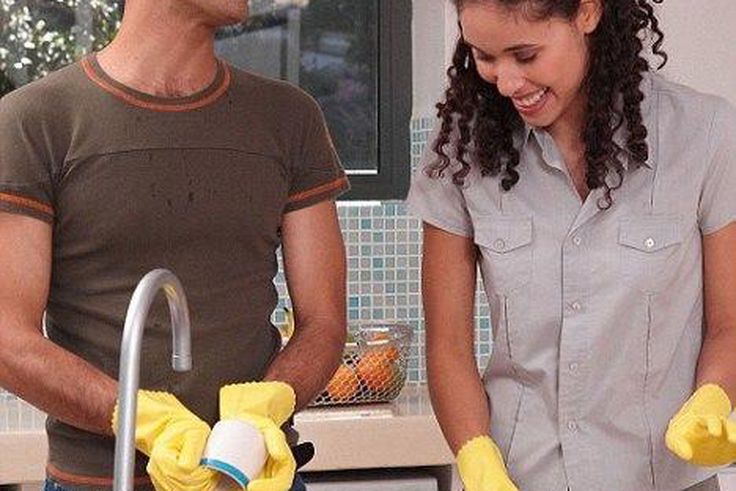 Happy couple doing chores