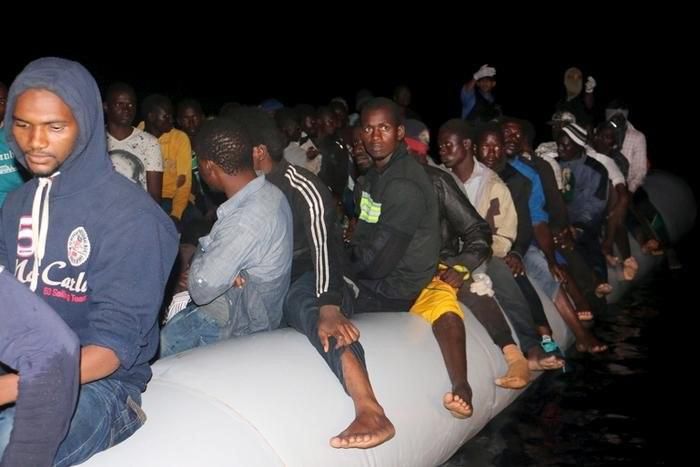 Illegal migrants are seen on a boat that they used, after being detained at a Libyan Navy base in the coastal city of Tripoli September 20, 2015. REUTERS/Hani Amara