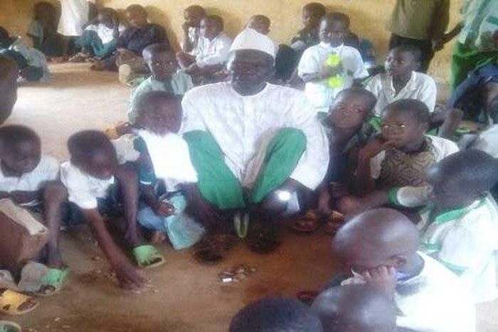 Sarkin Lambu and other pupils in their classroom