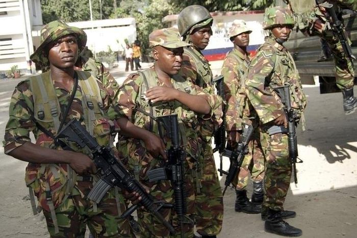 Members of the Kenyan Defence Forces (KDF) arrive at the police station, where its senior police commandant was killed, in Changamwe area of the Kenyan Coast, March 4, 2013. REUTERS/Charles Makunda