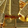Gold hovers near 3-week high as equities slip