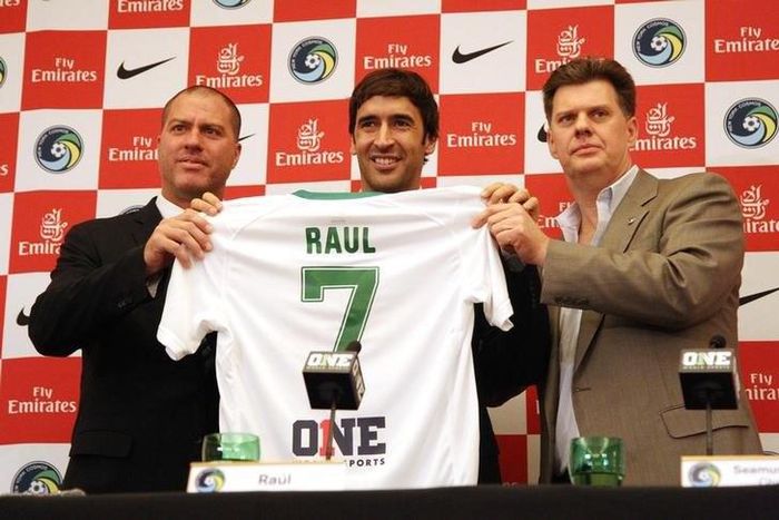 From left New York Cosmos head coach Gioavanni Savarese , player Raul Gonzalez and team chairman Seamus O'Brien pose for a photo with a jersey during a press conference at Four Seasons Hotel. Mandatory Credit: Noah K. Murray-USA TODAY Sports