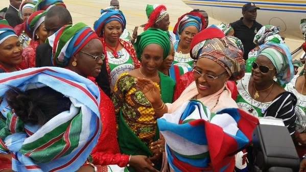 Wife of the President, Aisha Buhari (middle), wife of the Vice President, Dolapo Osinbajo (left) surrounded by women in Gombe state as the First Lady donated funds to bomb blast victims in the state.