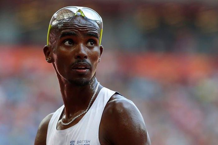 Mo Farah of Britain checks the scoreboard after the men's 5000 metres heats at the IAAF World Championships at the National Stadium in Beijing, China August 26, 2015. REUTERS/Lucy Nicholson