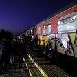 Migrants wait to get on a train after crossing into Macedonia, near the border with Greece, August 31, 2015. REUTERS/Ognen Teofilovski