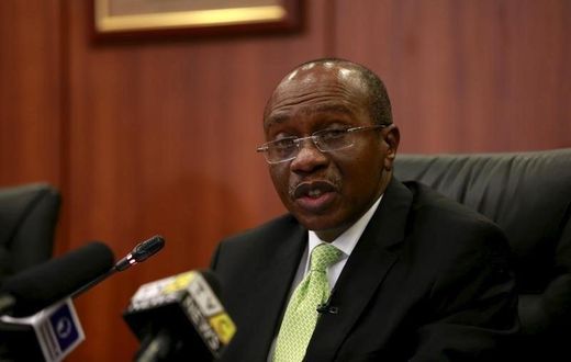 Governor Godwin Emefiele announces that Nigeria's central bank is keeping its benchmark interest rate on hold at 13 percent in Abuja, Nigeria, July 24, 2015. REUTERS/Afolabi Sotunde