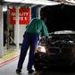 A worker inspects cars at BMW's manufacturing plant in Rosslyn, outside Pretoria, September 13, 2010. REUTERS/Siphiwe Sibeko