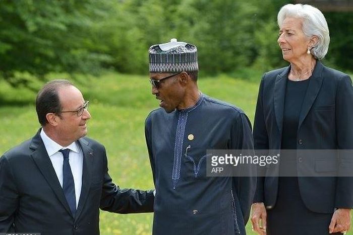 President Muhammadu Buhari discusses with French counterpart, Francois Hollande as IMF Managing Director, Christine Lagarde looks on.