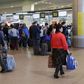 Passengers stand in a line to get registered for the flight ZF 9785 of Azur Air from Domodedovo airport to Sharm al-Sheikh outside Moscow, Russia, November 6, 2015.