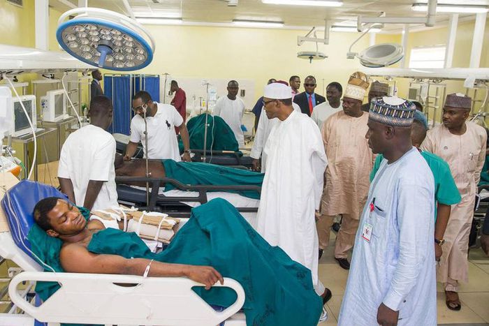 Buhari visits victims of bomb blasts, robbery, orders payment of medical bills