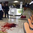 Israeli security personals stand next to blood on the floor, at the Beersheba central bus station where a Palestinian gunman went on a stabbing and shooting rampage, October 18, 2015.  REUTERS/Dudu Grunshpan